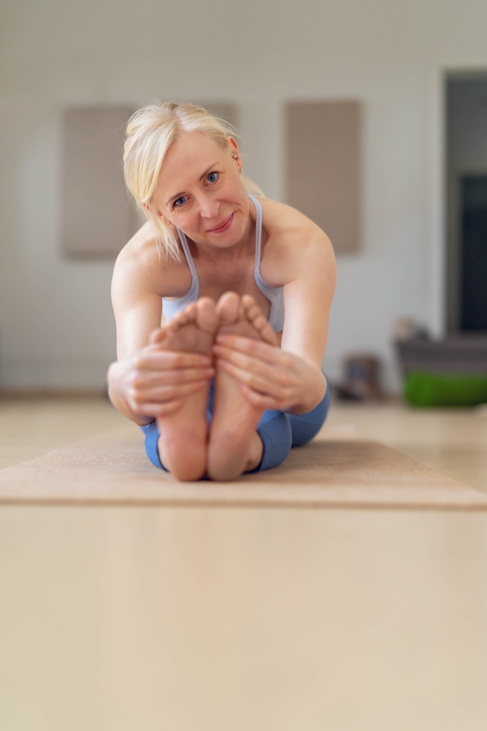 A member stretching during a Pilates session at 360 Core Studio